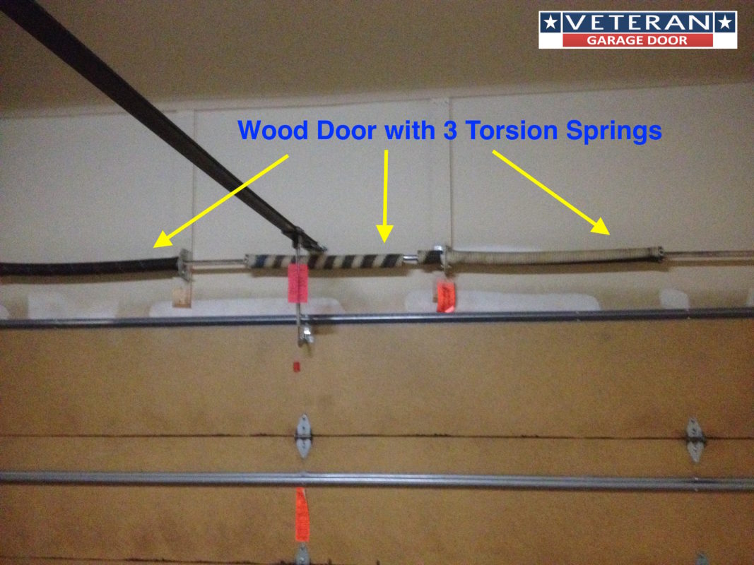 three-torsion-spring-wood-door