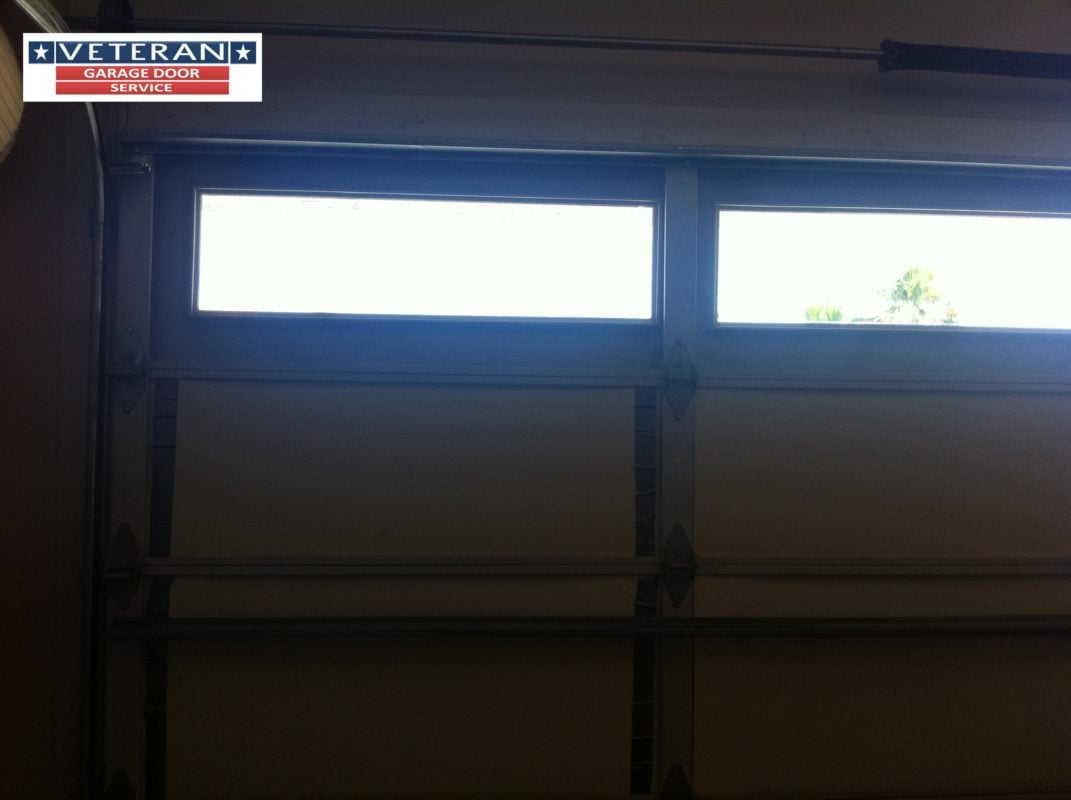 How do you repair a broken garage door window?