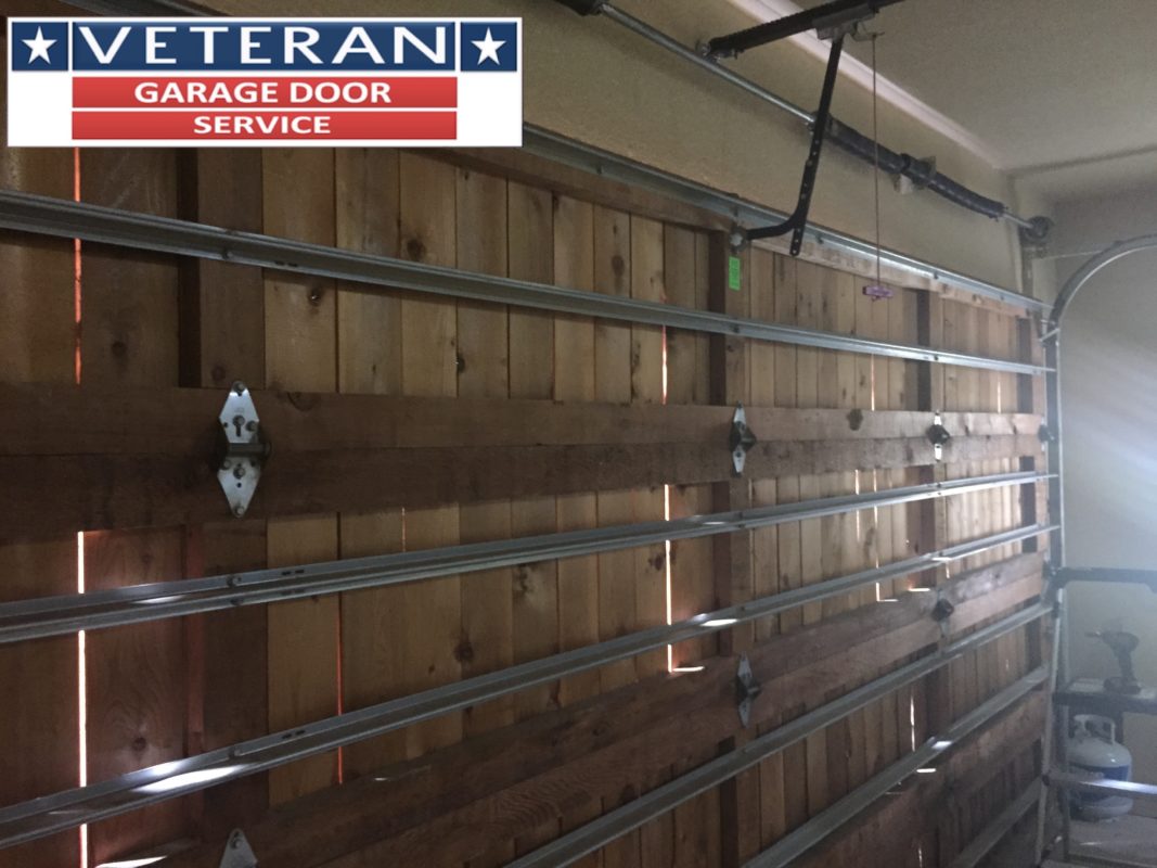 What kind of bolts should be used on a wooden garage door