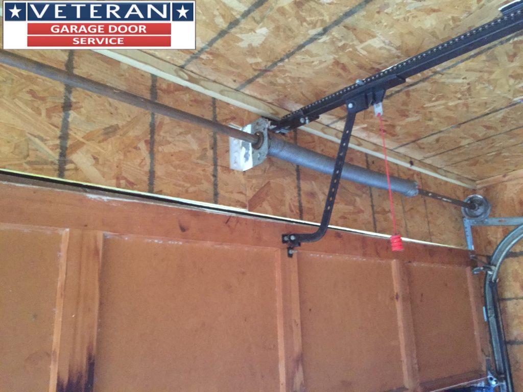 What kind of bolts should be used on a wooden garage door