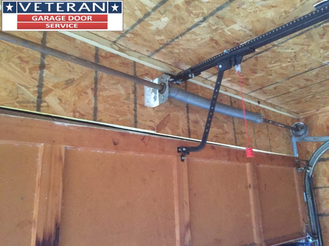 What kind of bolts should be used on a wooden garage door