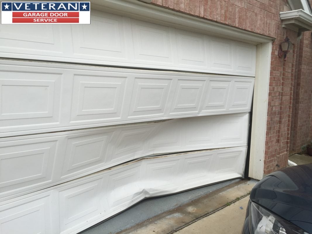 Should I install a strut or replace my garage door section