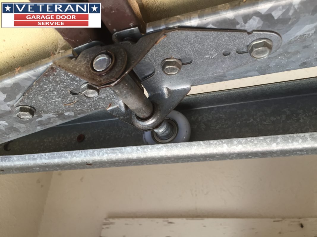 How do you know if garage door rollers should be replaced