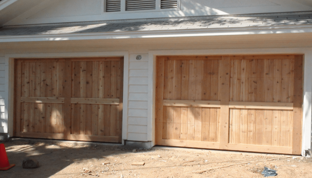 iron wood veteran garage door ready to paint