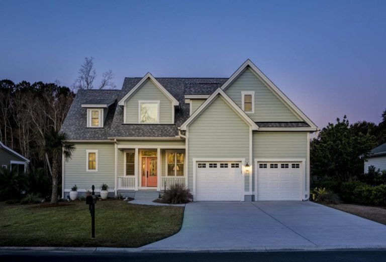 front elevation of beautiful home lit up at twilight 1 1