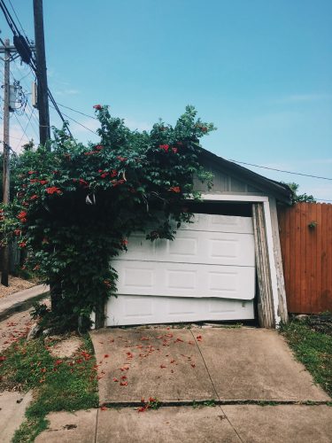 Garage door with broken springs results in damaging the whole thing