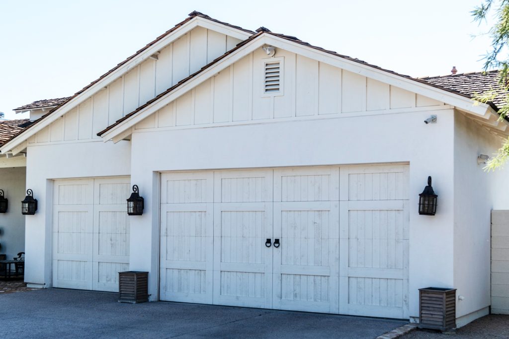 A full view from the outside of a garage with insulated doors
