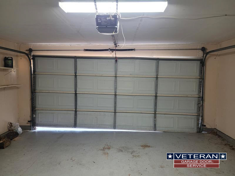 Closed garage door with overhead opener