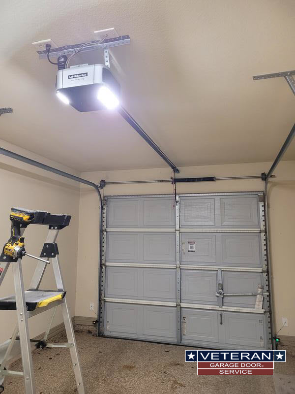 Garage with door opener and ladder present